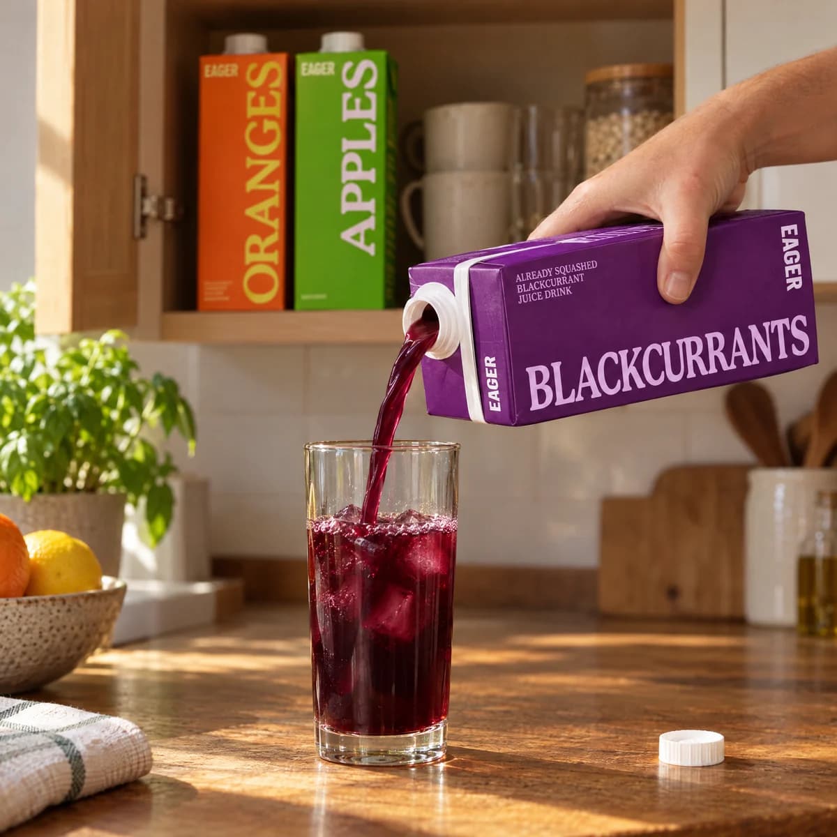 Purple juice poured from the carton into a glass of ice, as the model made it.