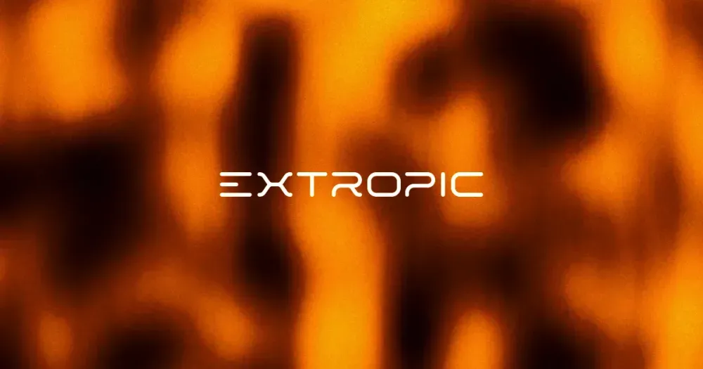 Extropic brand image: The Extropic wordmark over amber light