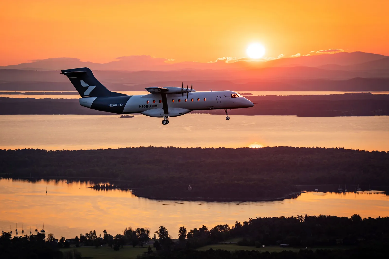 Heart Aerospace brand image: X1 at sunrise over Lake Champlain