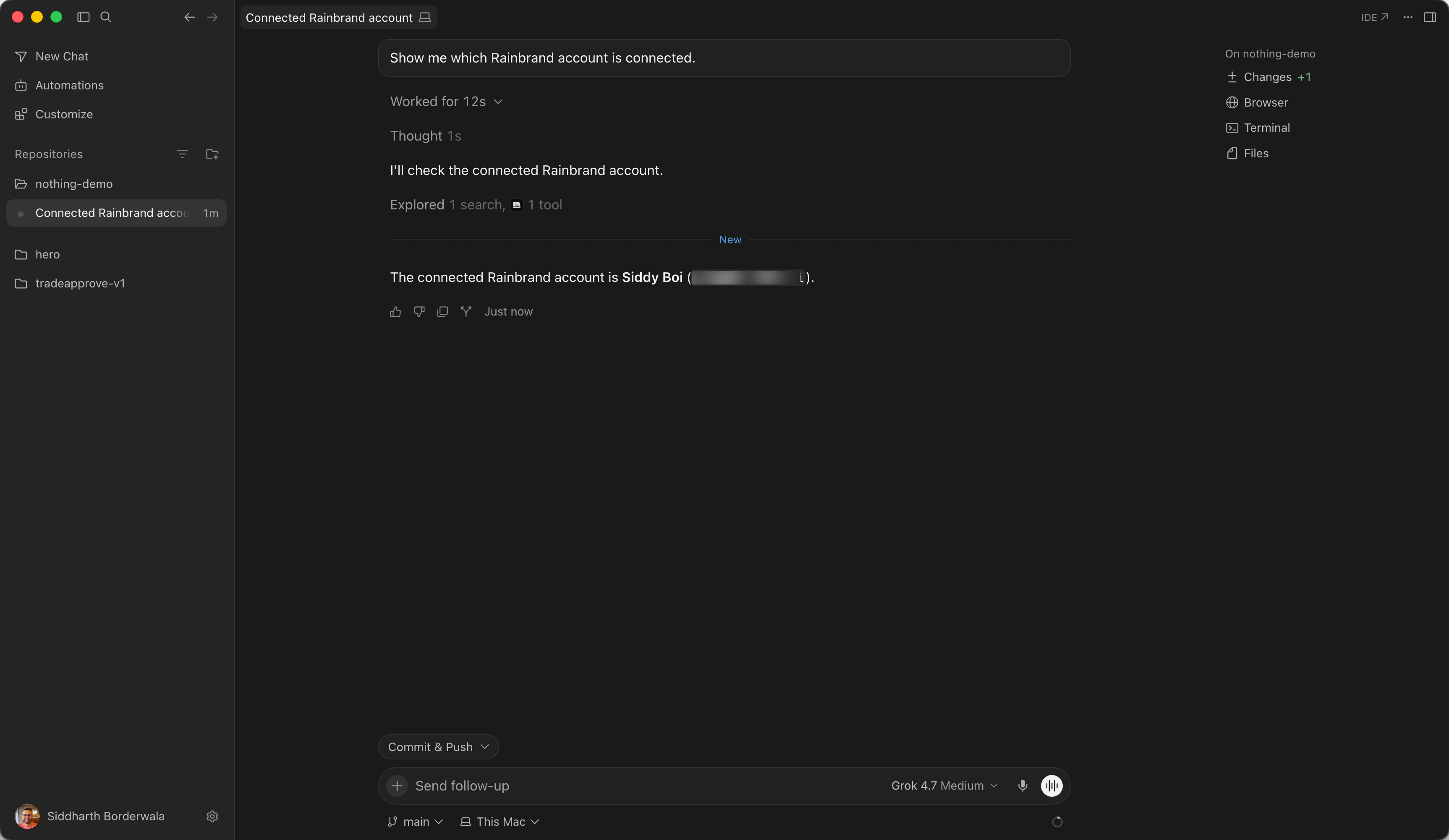 Cursor's Agent replying with the connected Rainbrand account's name after one Rainbrand tool call, with the email blurred