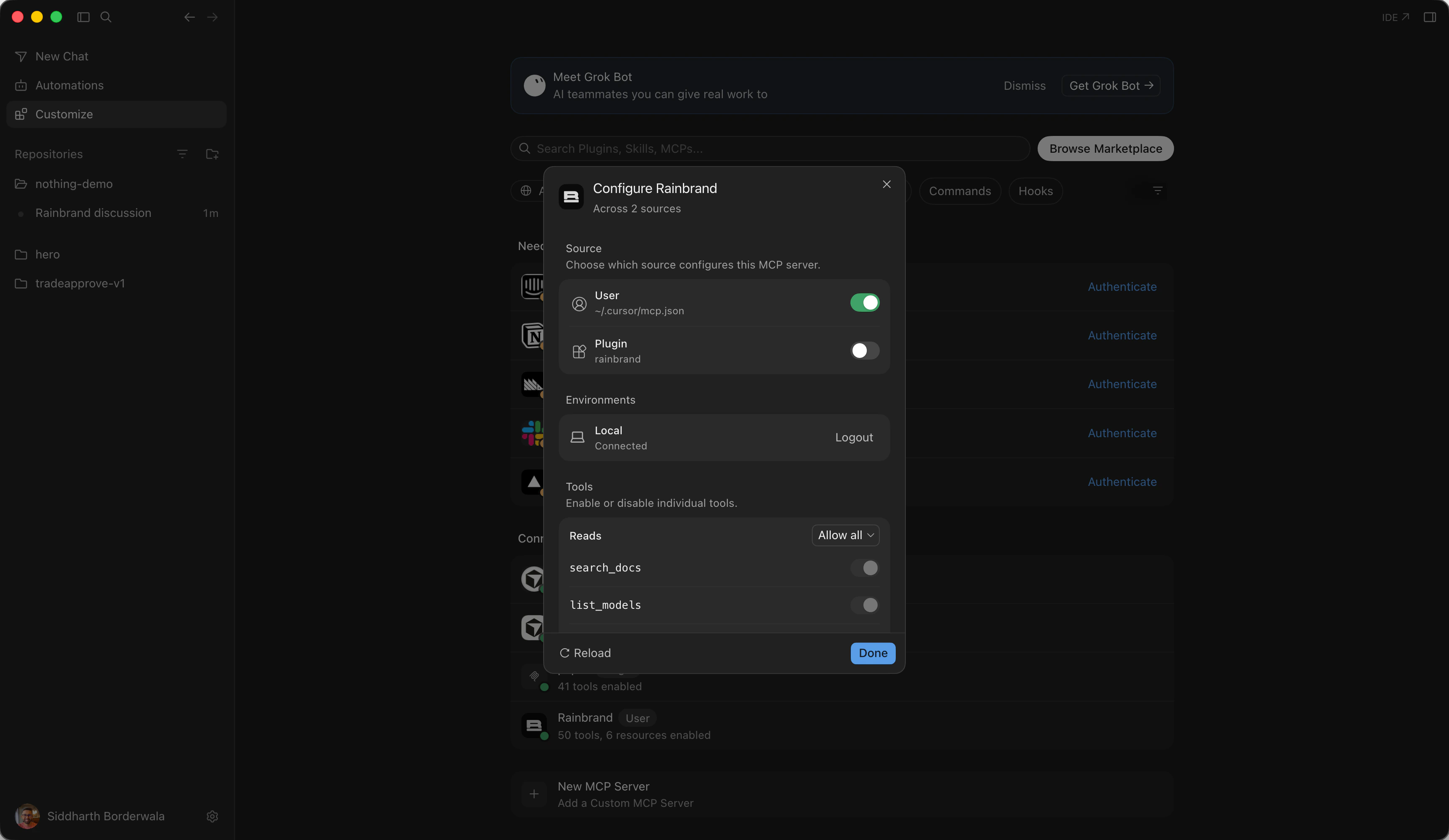 Cursor's Configure Rainbrand dialog under Customize: the server from ~/.cursor/mcp.json switched on, the plugin's copy switched off, the local environment connected, and a list of Rainbrand's tools. Behind it, Rainbrand is listed with 50 tools and 6 resources enabled.